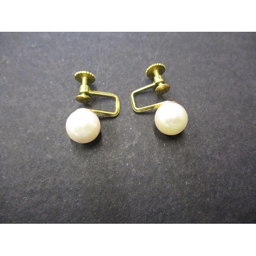 72 - A pair of 585 gold and cultured pearl screw on earrings