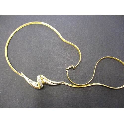 84 - A 14ct yellow gold choker style necklace with diamond set pendant