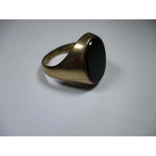 1 - A 9ct gold signet ring with jet panel, approx. weight 6.8g