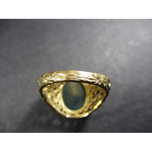 13 - A 9ct gold signet ring set with a hard stone, approx. ring size R1/2