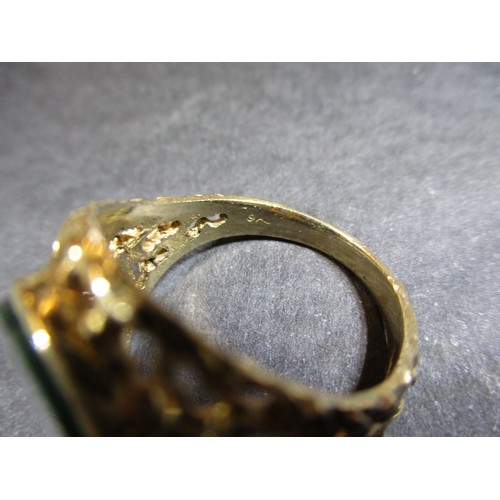 13 - A 9ct gold signet ring set with a hard stone, approx. ring size R1/2