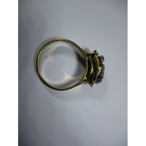 41 - An 18ct yellow gold ring set with 8 diamonds in a stylized setting, approx. ring size P1/2