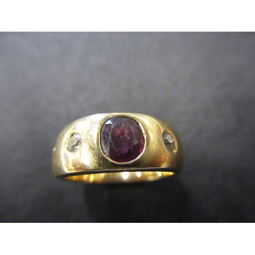 52 - A yellow gold ring with central ruby flanked by 2 diamonds, approx. ring size M