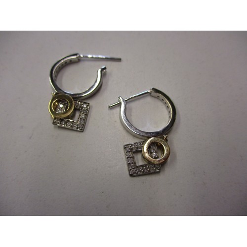 70 - A pair of white gold earrings with yellow gold gem set drops