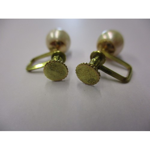 72 - A pair of 585 gold and cultured pearl screw on earrings