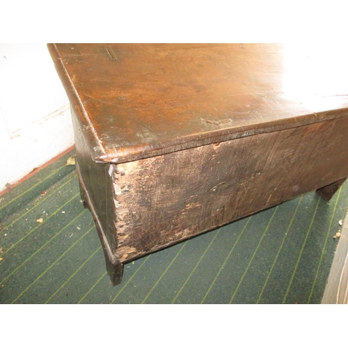 385 - An antique elm coffer having original lock and hinges, carving to front panel.