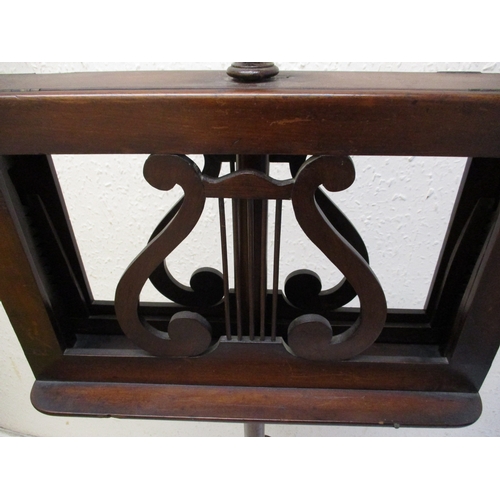 378 - A William IV mahogany music stand with twin supports on adjustable column