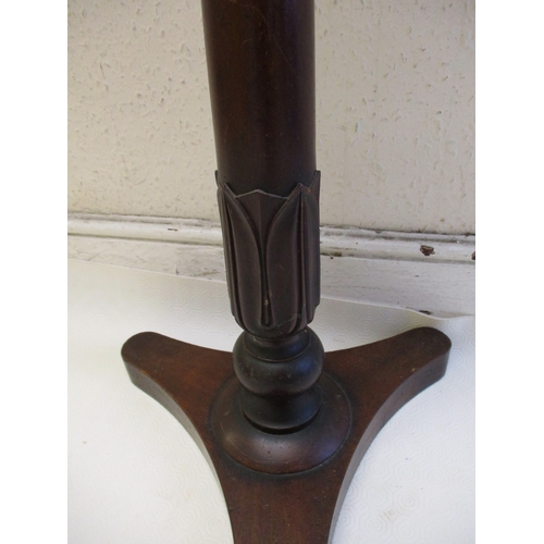 378 - A William IV mahogany music stand with twin supports on adjustable column