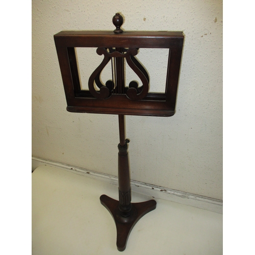 378 - A William IV mahogany music stand with twin supports on adjustable column