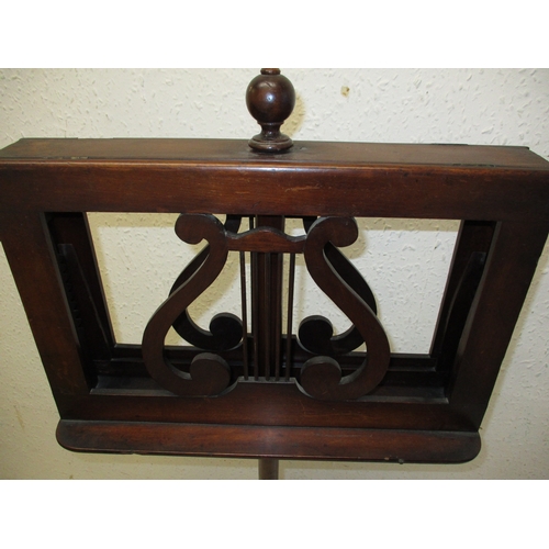 378 - A William IV mahogany music stand with twin supports on adjustable column