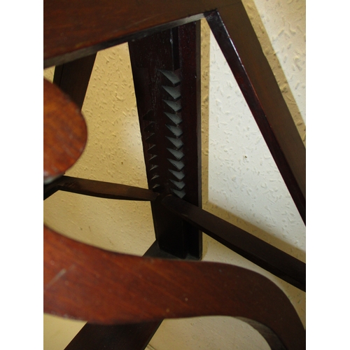 378 - A William IV mahogany music stand with twin supports on adjustable column