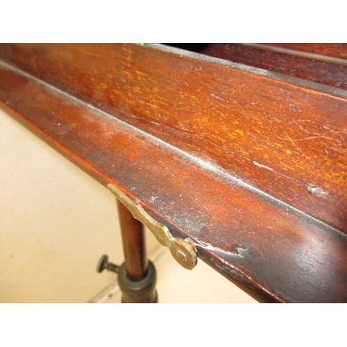 378 - A William IV mahogany music stand with twin supports on adjustable column