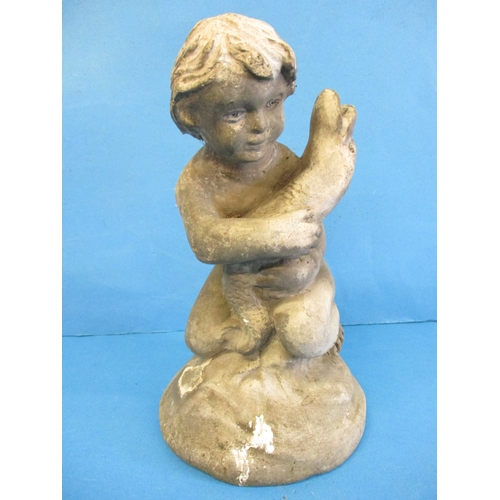 324 - An early 20th century cast lead garden pond ornament of a child holding a fish