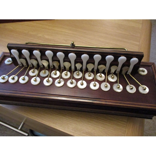 282 - A 19th century Flutina accordion with mahogany body, boxwood stringing and mother of pearl keys.