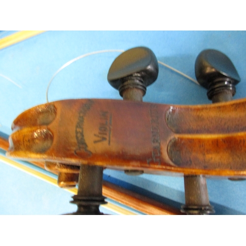 284 - An early 20th century violin in hard case with 3 bows