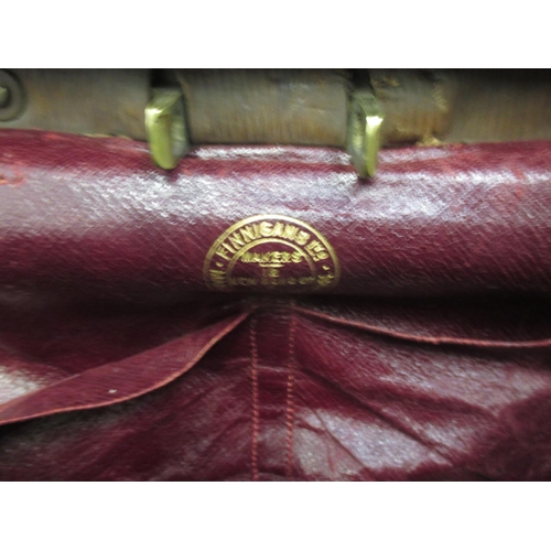 290 - A large antique leather Gladstone travel bag by Finnigans.