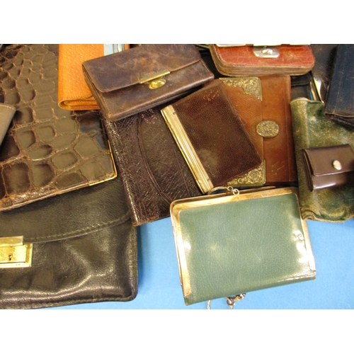 291 - A very large quantity of antique and later purses and wallets, most of leather, some with silver mou... 