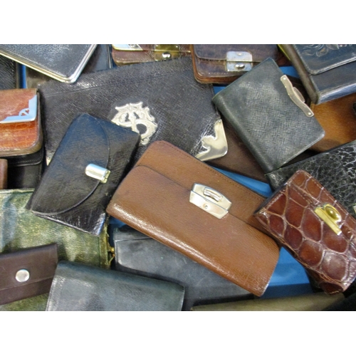 291 - A very large quantity of antique and later purses and wallets, most of leather, some with silver mou... 