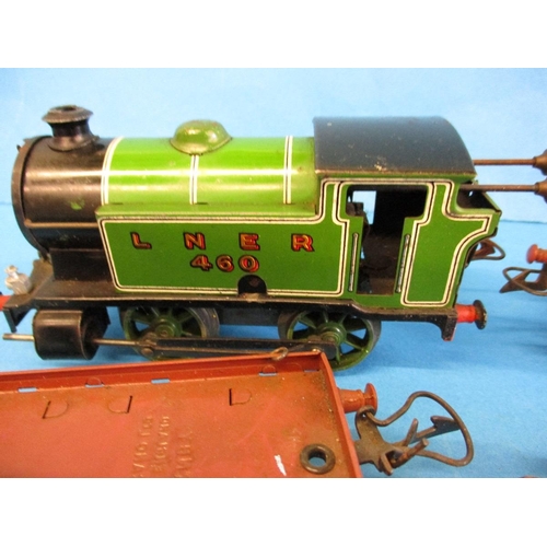 272 - A Hornby O gauge 0-4-0 clockwork tank engine No 460 and 4 waggons.