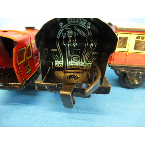 277 - Two Hornby clockwork engines and 2 vans, in working order