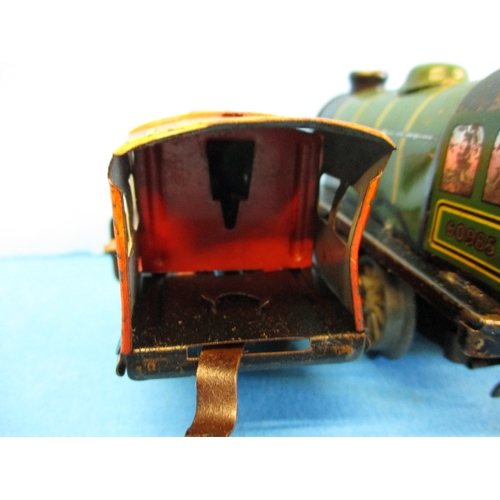 277 - Two Hornby clockwork engines and 2 vans, in working order