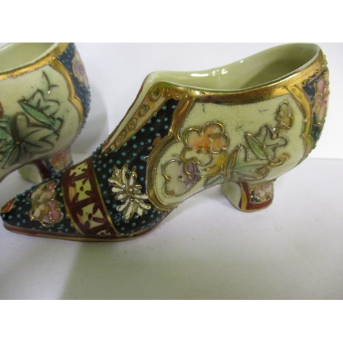 255 - Two vintage miniature oriental porcelain shoes, with polychrome tubeline decoration