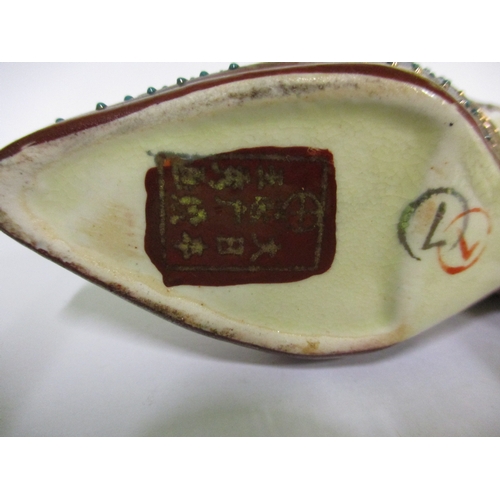 255 - Two vintage miniature oriental porcelain shoes, with polychrome tubeline decoration