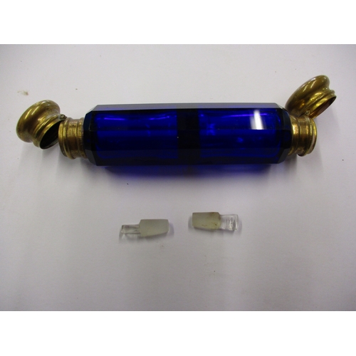 240 - An antique blue glass double ended perfume bottle with bass mounts