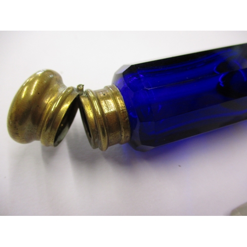 240 - An antique blue glass double ended perfume bottle with bass mounts