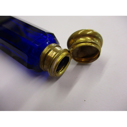 240 - An antique blue glass double ended perfume bottle with bass mounts