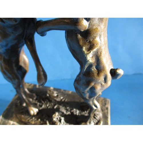 243 - A cast bronze sculpture of dancing hares, signed to base NICK