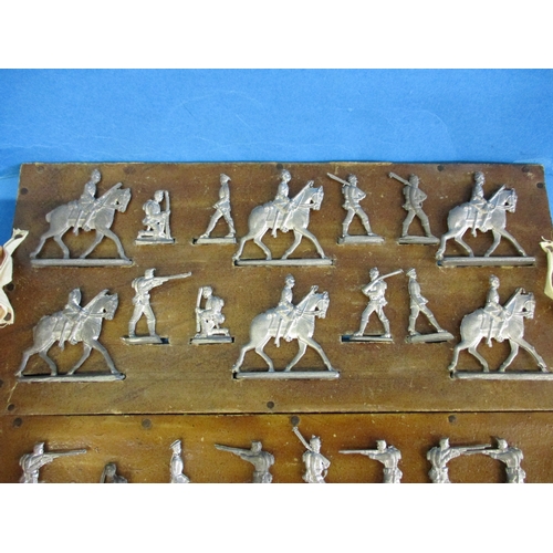 234 - A box of vintage cast lead soldiers