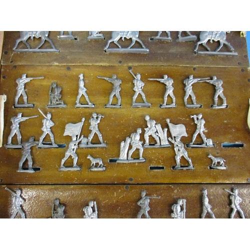 234 - A box of vintage cast lead soldiers