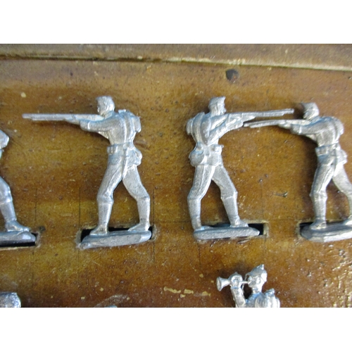 234 - A box of vintage cast lead soldiers