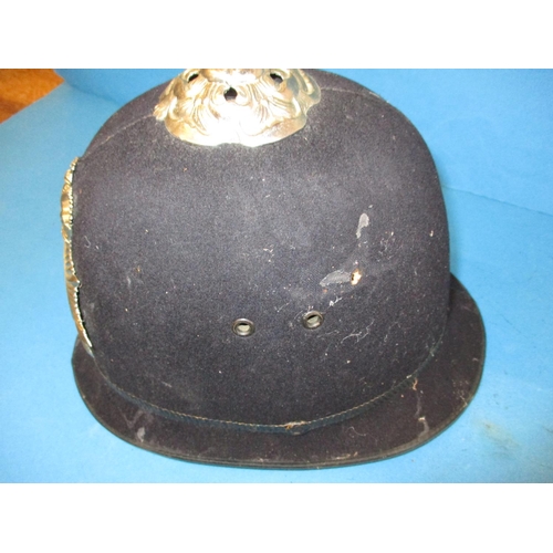 213 - Two vintage army helmets, a Military police helmet and a Metropolitan police helmet