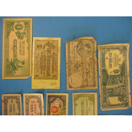 219 - A small quantity of original WW2 occupation currency banknotes.