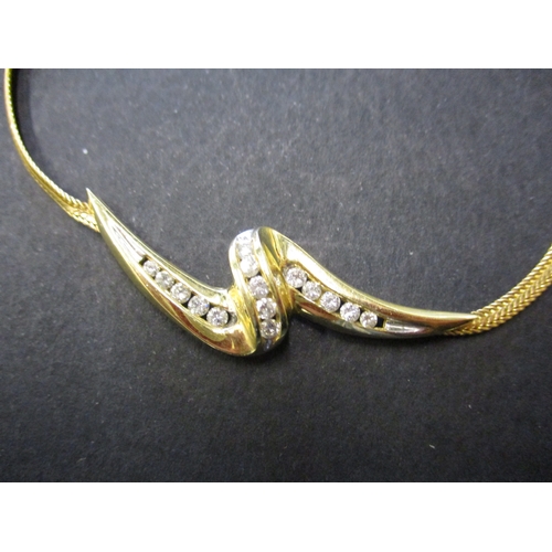 84 - A 14ct yellow gold choker style necklace with diamond set pendant