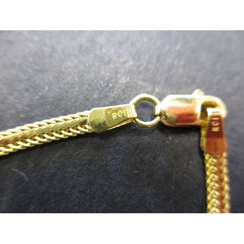 84 - A 14ct yellow gold choker style necklace with diamond set pendant