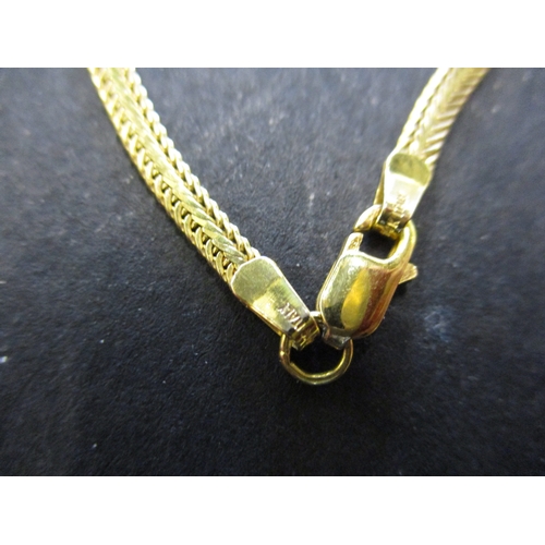 84 - A 14ct yellow gold choker style necklace with diamond set pendant