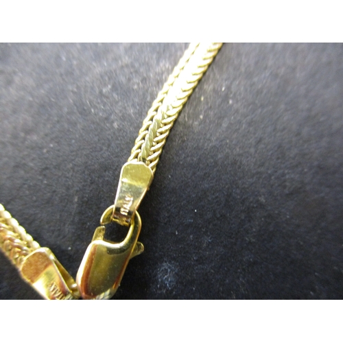 84 - A 14ct yellow gold choker style necklace with diamond set pendant