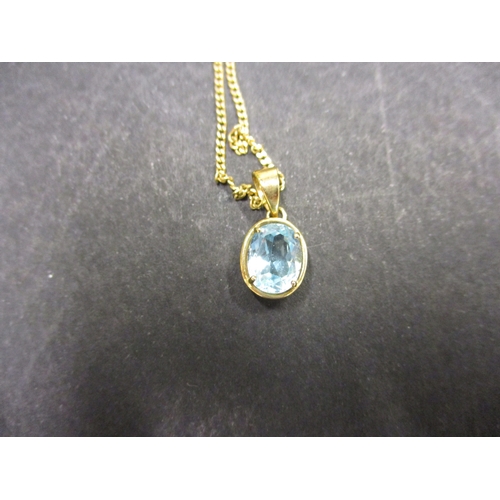 88 - A 9ct gold necklace with aquamarine? Pendant. Approximate weight 3.7g.