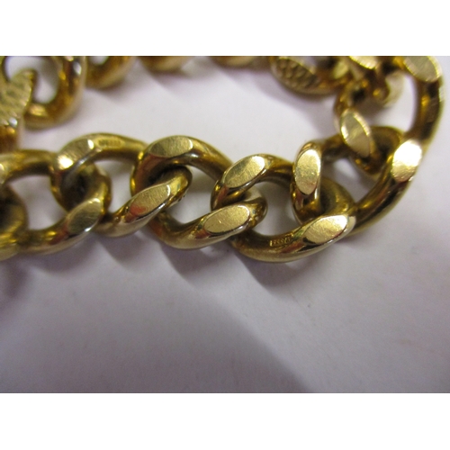 98 - A heavy 9ct gold embossed curb link bracelet. With working clasp and safety chain. Approximate weigh... 