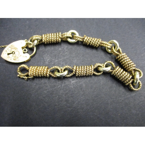 99 - A 9ct gold twisted rope bracelet, with padlock clasp, Approximate weight 52.8g.