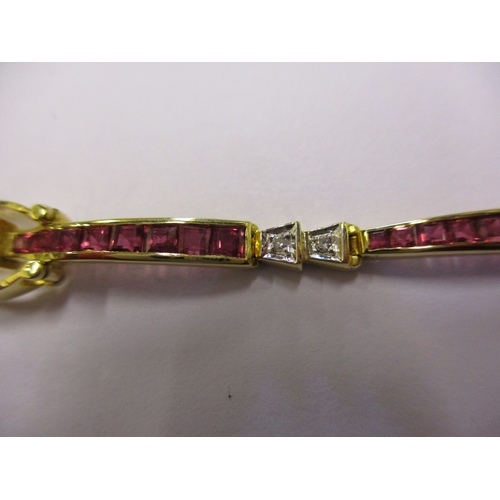 109 - An 18ct gold bracelet set with rubies and diamonds