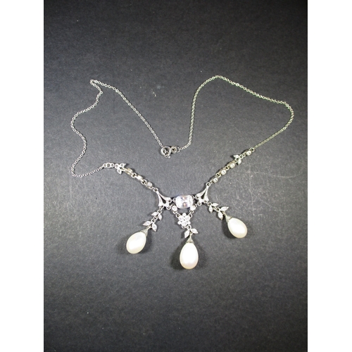 116 - A bespoke made silver, pearl and simulated diamond necklace