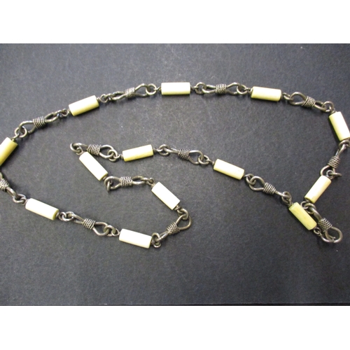 123 - Two vintage African white metal and bone necklaces