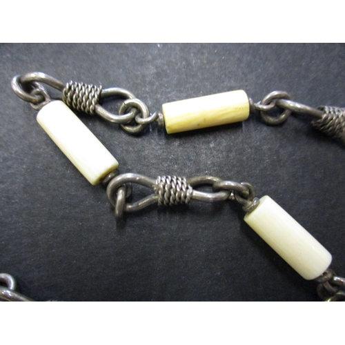 123 - Two vintage African white metal and bone necklaces