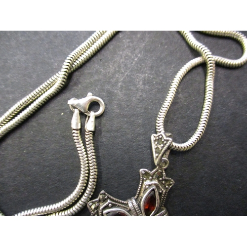 124 - 2 Sterling silver necklaces with pendants