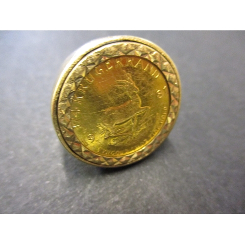 131 - A 9ct gold signet ring set with a 1981 quarter Krugerrand