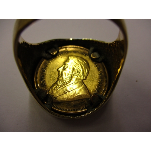 131 - A 9ct gold signet ring set with a 1981 quarter Krugerrand